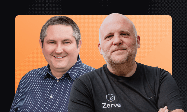 Two men pose against an orange backdrop: left wearing a patterned button-down and smiling; right bald in a black "Zerve" T-shirt with arms crossed.